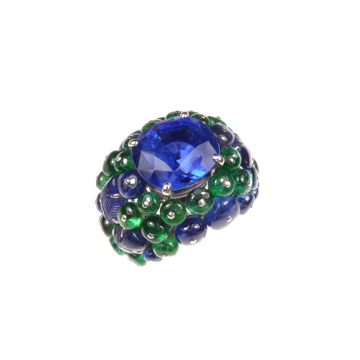 Cushion cut sapphire, emerald and sapphire bombe cluster ring by Cartier, the Ceylon sapphire, 11.08ct